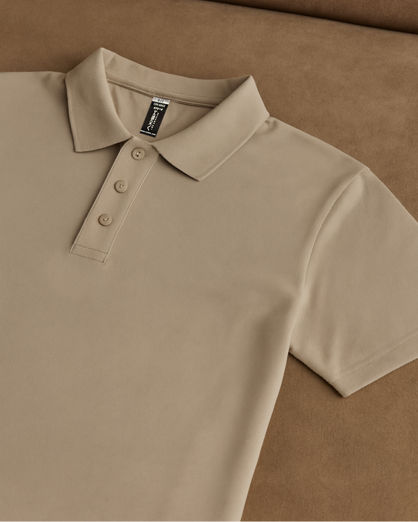 Beige polo shirt on a brown background